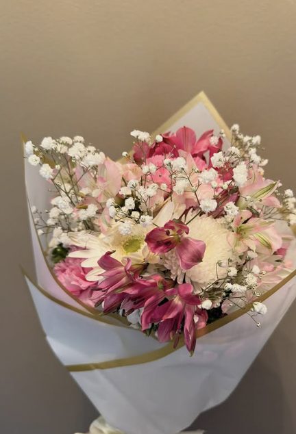 Blush and white garden bouquet with gold ribbon