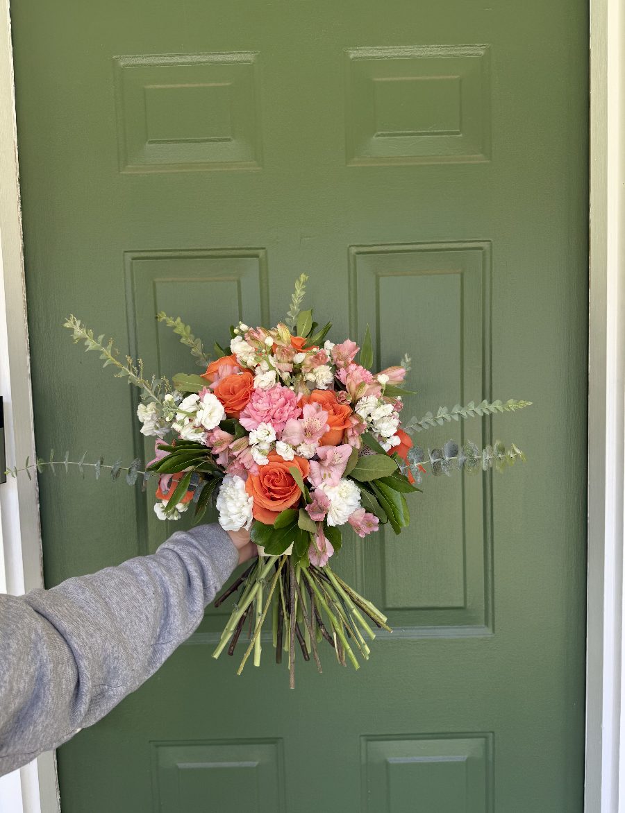 Orange, pink, and white garden rose and carnation bouquet